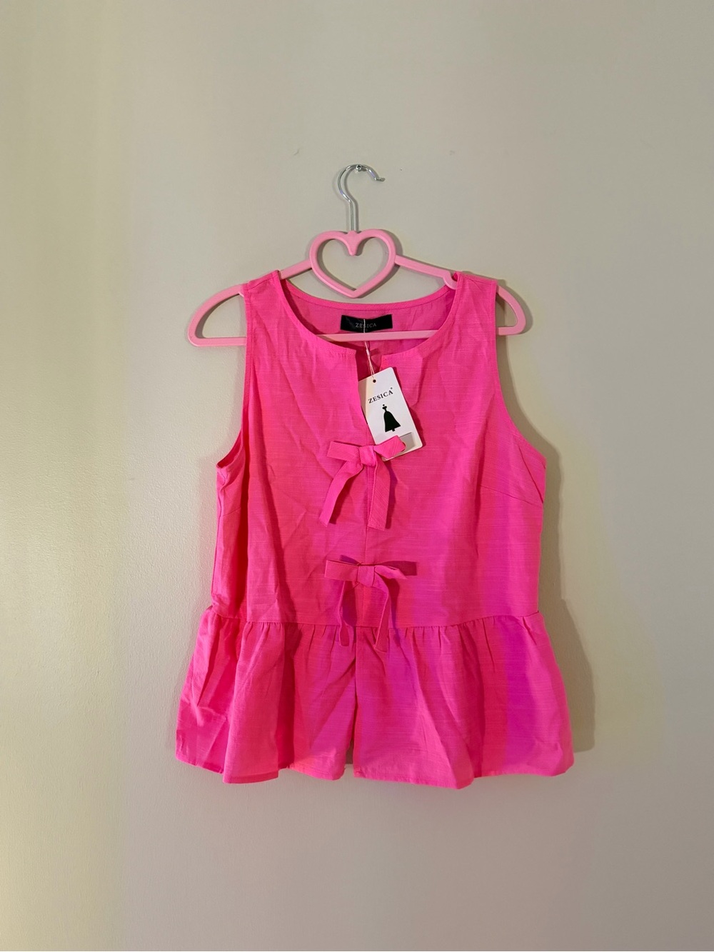 Bright Pink Sleeveless Peplum Top with Front Bows
